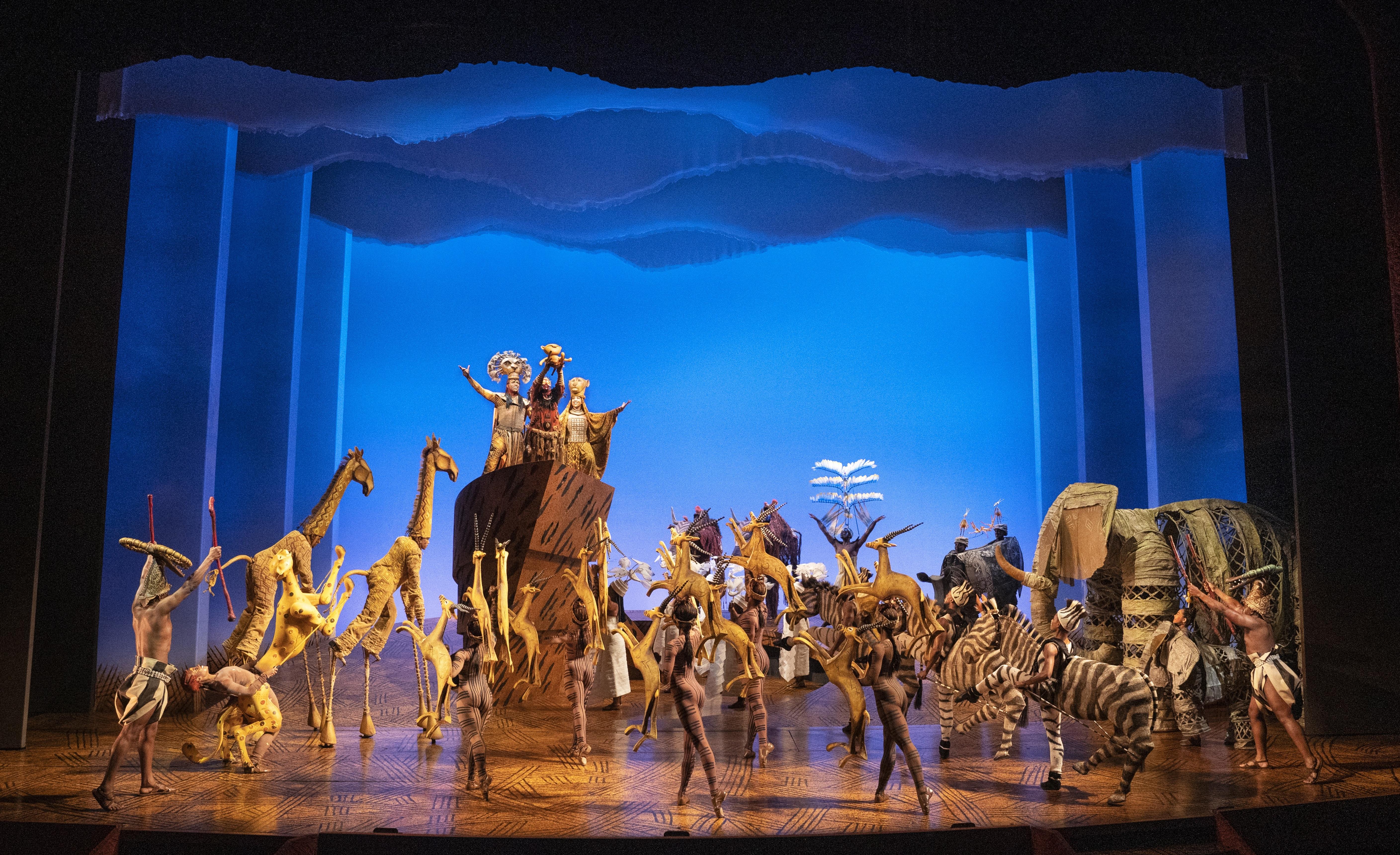 Julie Taymor with The Lion King masks and puppets